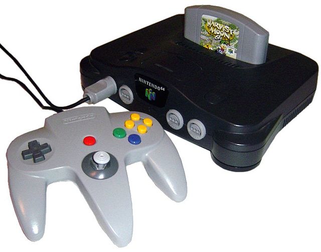 Nintendo 64 s ovladačem a vloženou cartridgí Harvest Moon 64